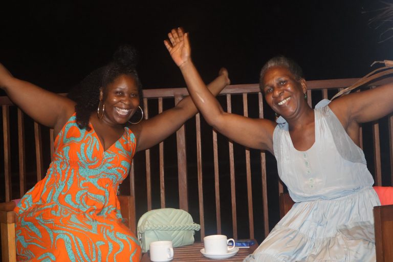 two ladys on the balcony from their hotel