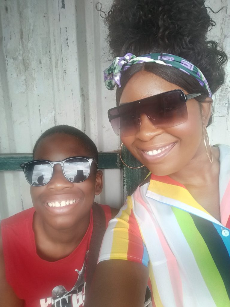 A lady and her son together on holiday