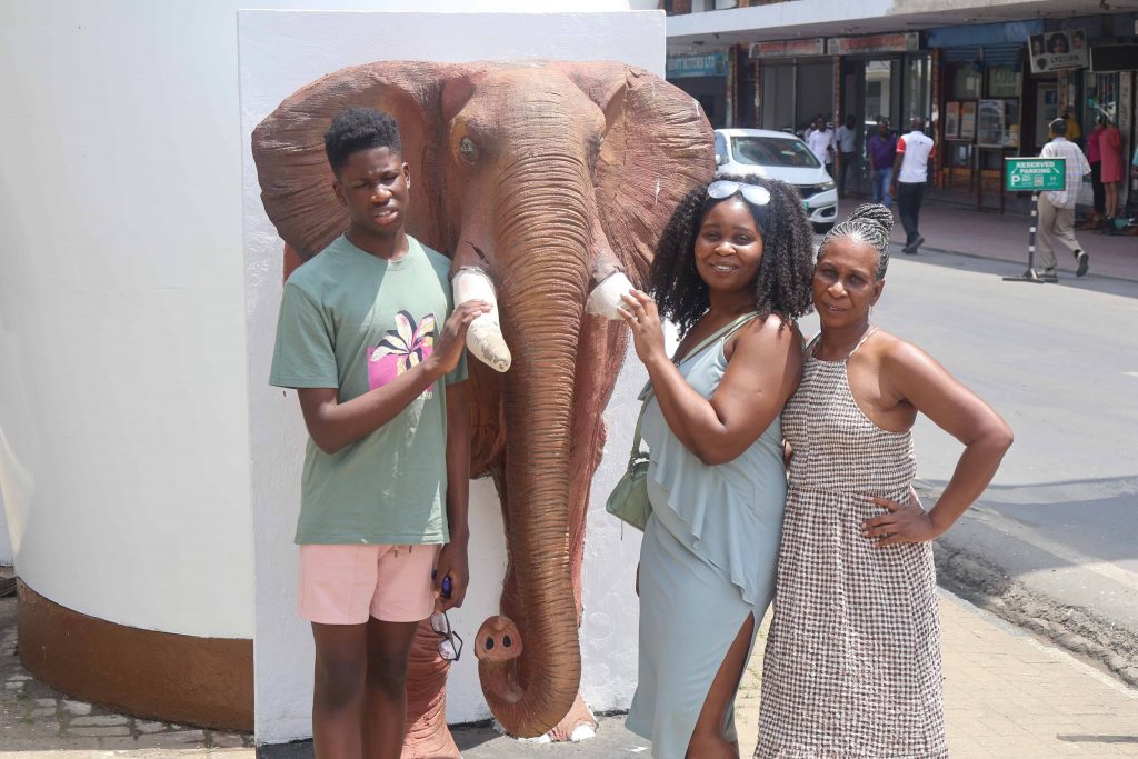 a family at the elephant tusks in mombasa